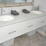 Solid surface white double sink bathroom vanity custom countertops Mike's Countertop Shop Sudbury Ontario.